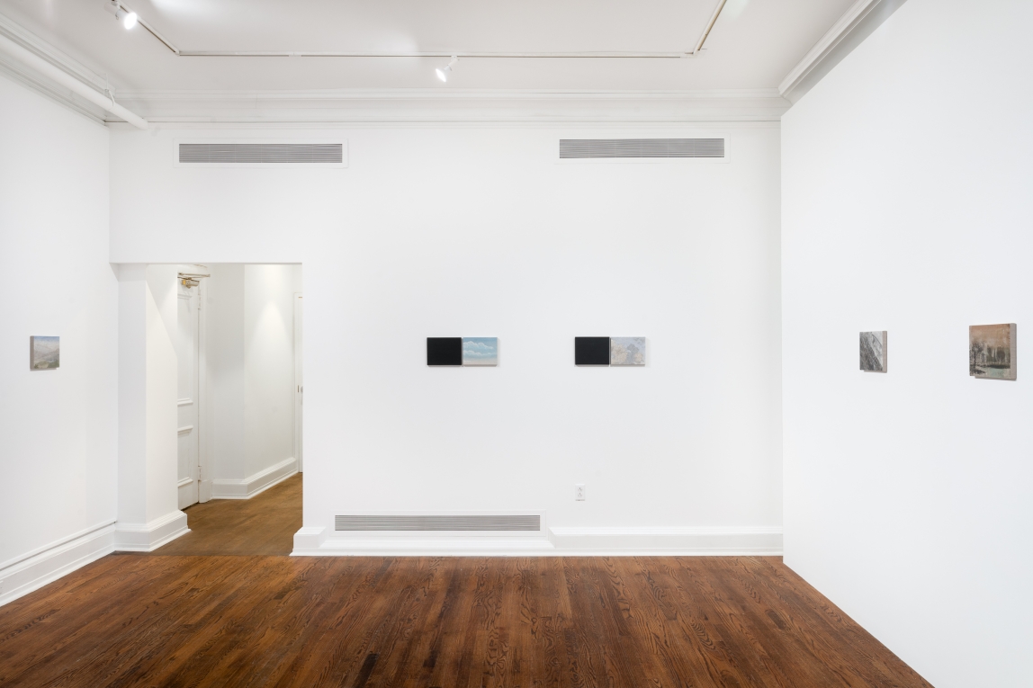 Installation view of series of small works aligned across three walls