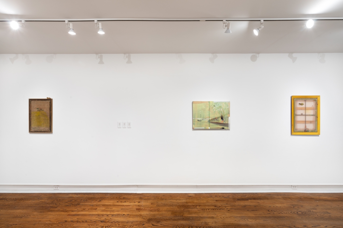 Installation image of three paintings hanging on a wall