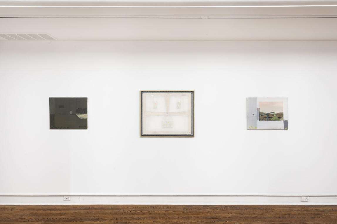 Installation view of three paintings on a wall