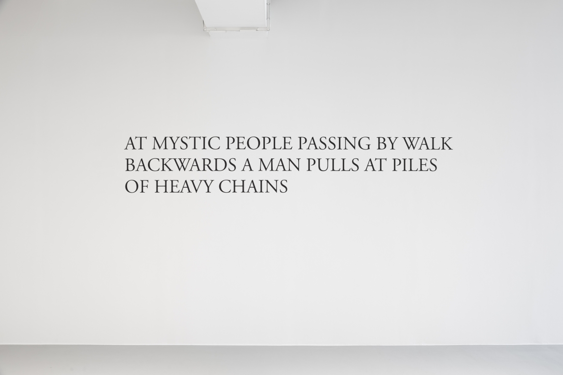 Installation view of large text on a wall