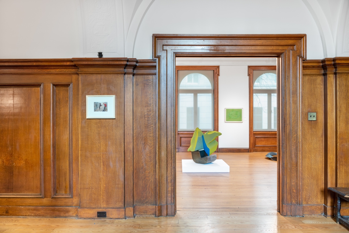 Installation view of Gallery B from hallway with focus on green and blue sculpture