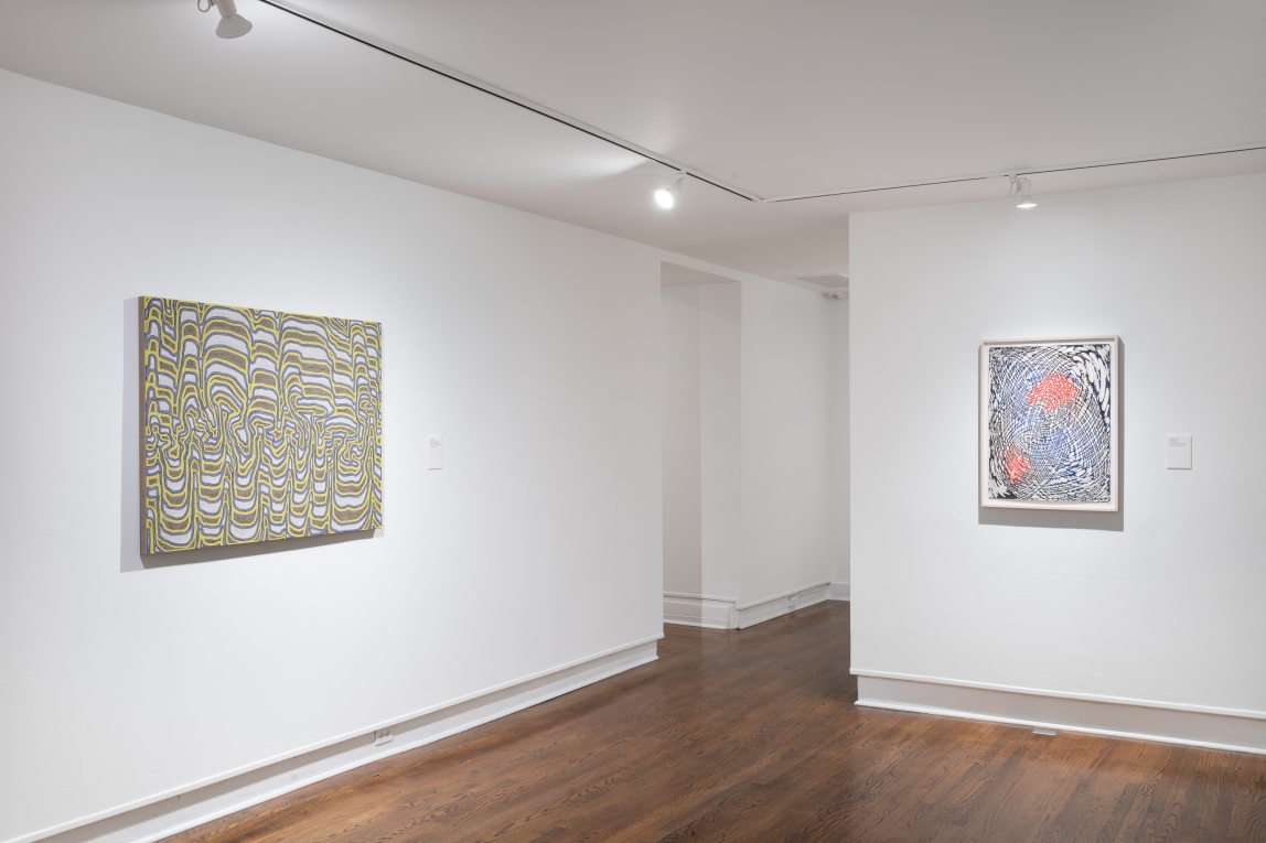 Installation view of two framed works featuring lines