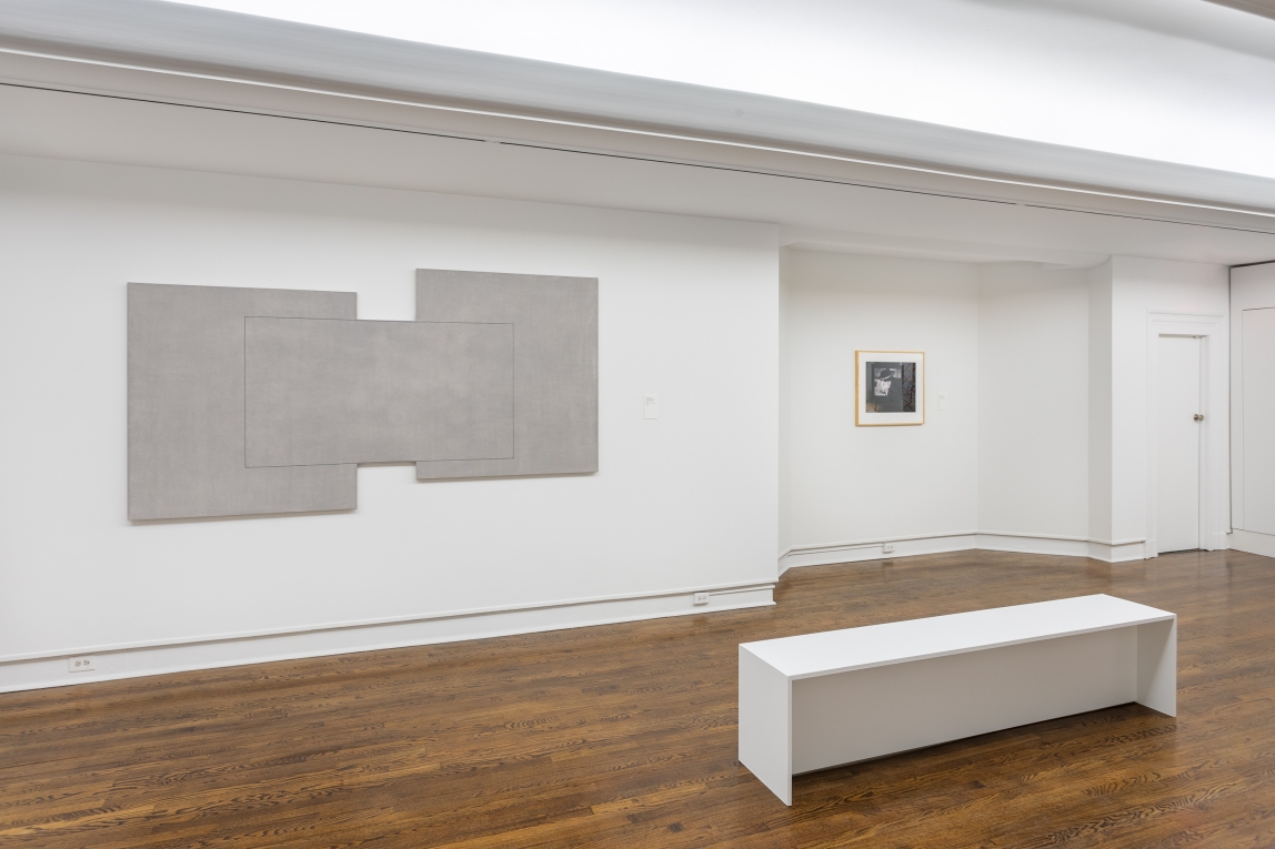 Installation view of Gallery F with two works on wall and bench in front