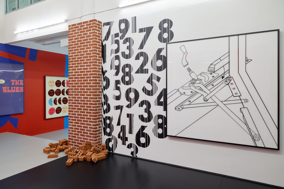 Installation view of The Street with brick column, mural with numbers and large black and white painting