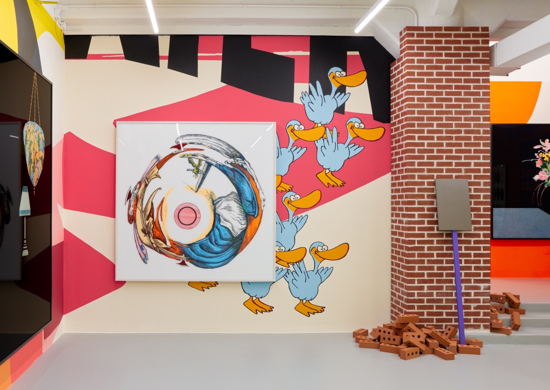 Installation view of The Street showing a large painting of spinning objects, murals and bricks