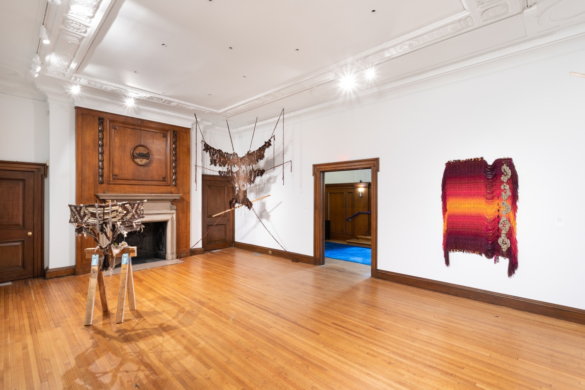 Installation view of gallery with three fiber works on display