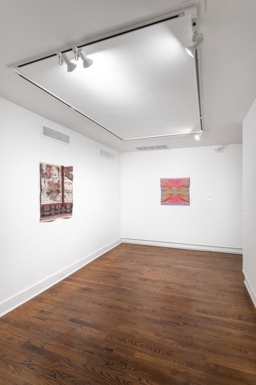 Installation view of two smaller fiber artworks hung on adjoining walls