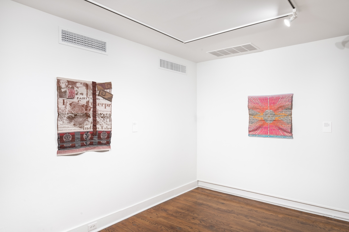 Installation view of two smaller woven fiber artworks, hung on adjoining walls