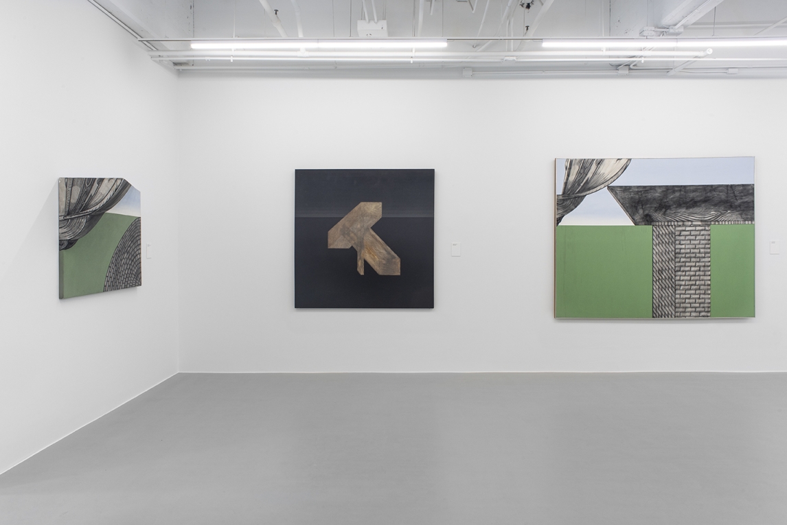 Installation image of three paintings hanging on two walls
