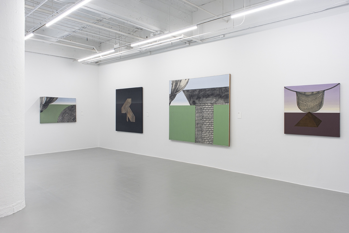 Installation image of corner of gallery displaying four large paintings