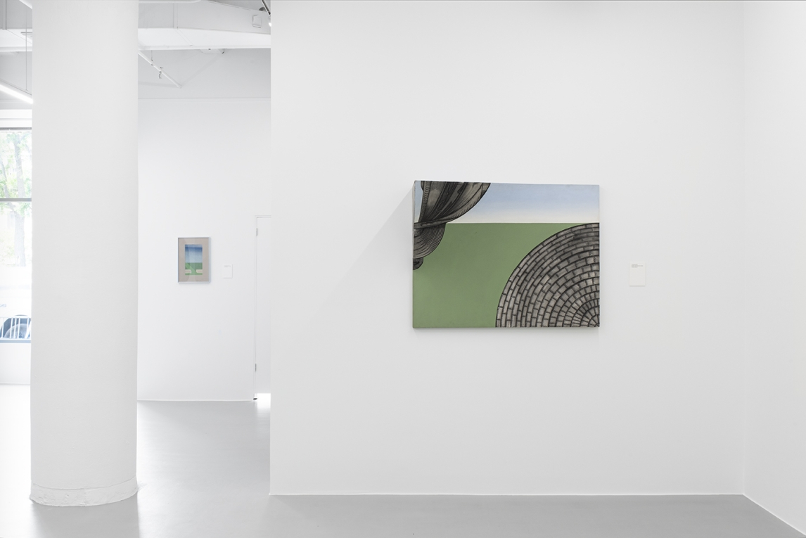 Installation image of painting in foreground and smaller painting in background