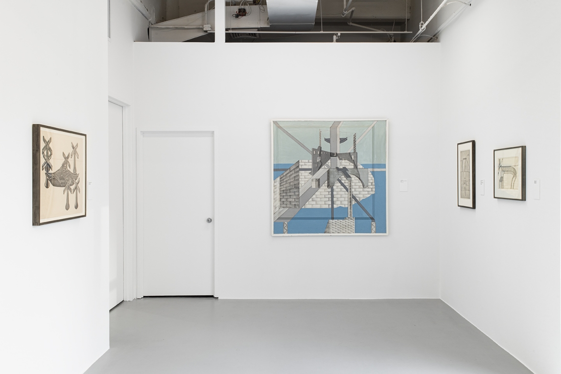 Installation view of gallery with three walls displaying four works