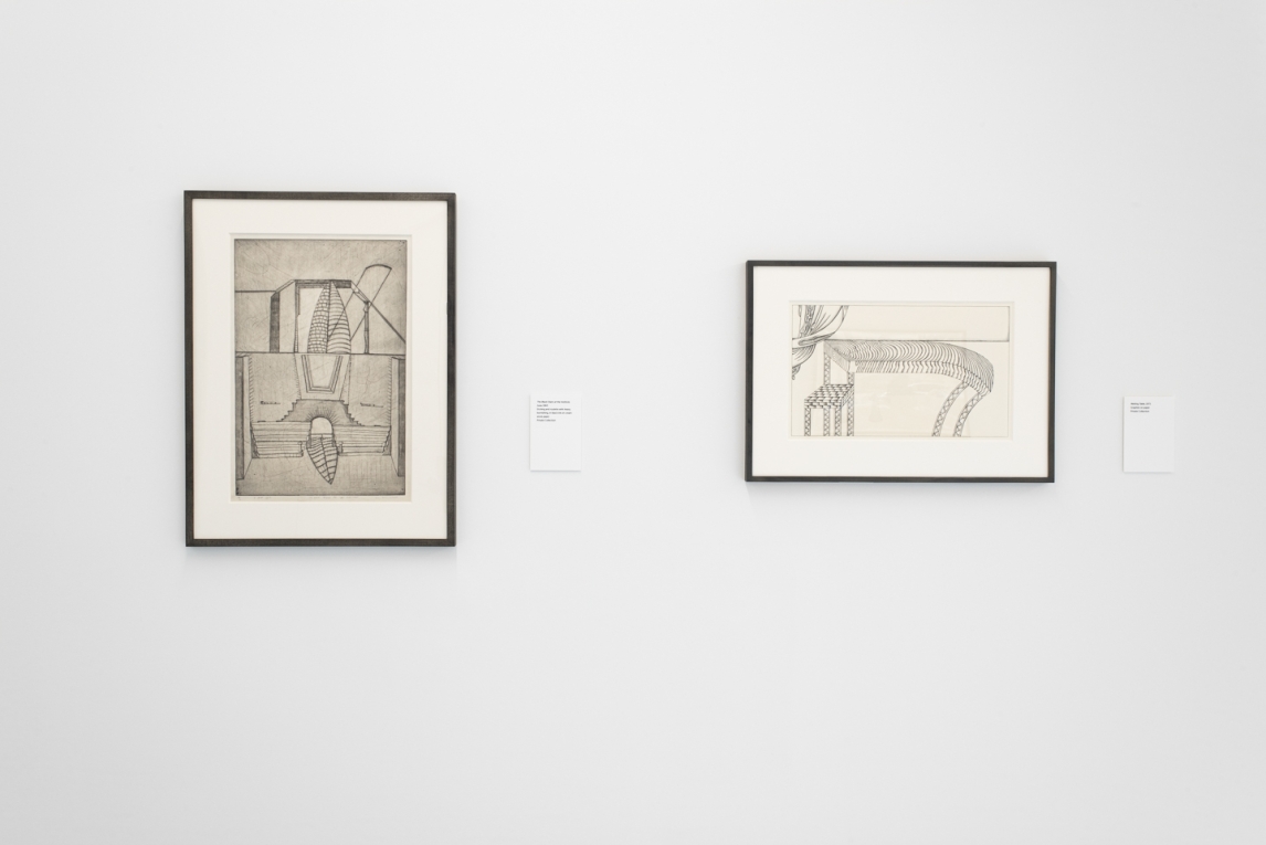 Installation image of two smaller black and white works on a  wall