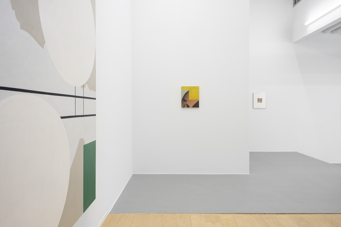 Installation view of small painting on white wall surrounded by other walls with other works