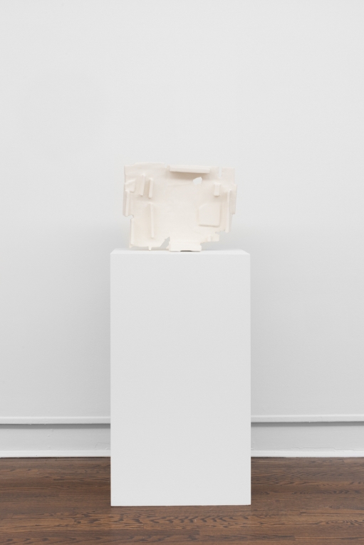 White mixed media sculpture on pedestal