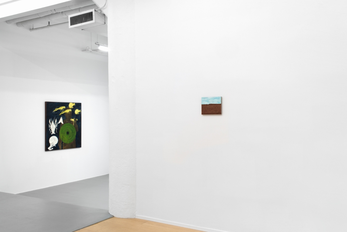 Installation view of two paintings of different sizes on different walls