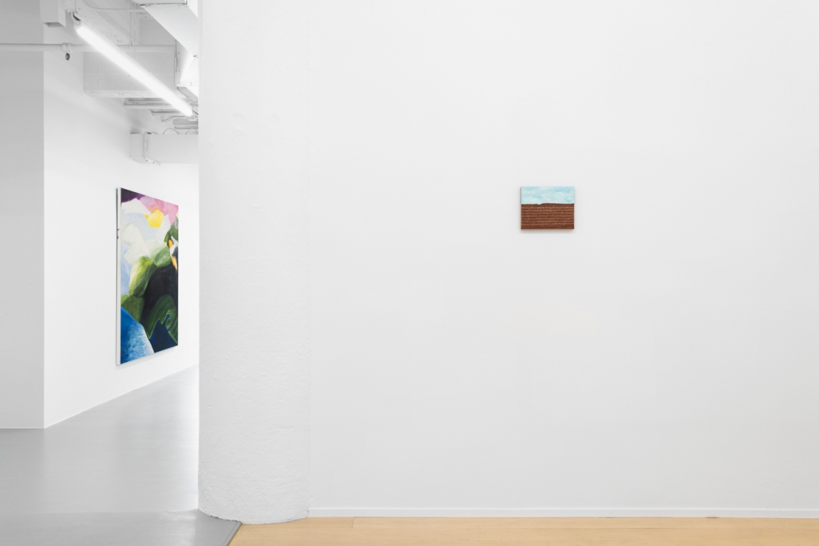 Installation view of two paintings on two different walls, one in foreground, one in back