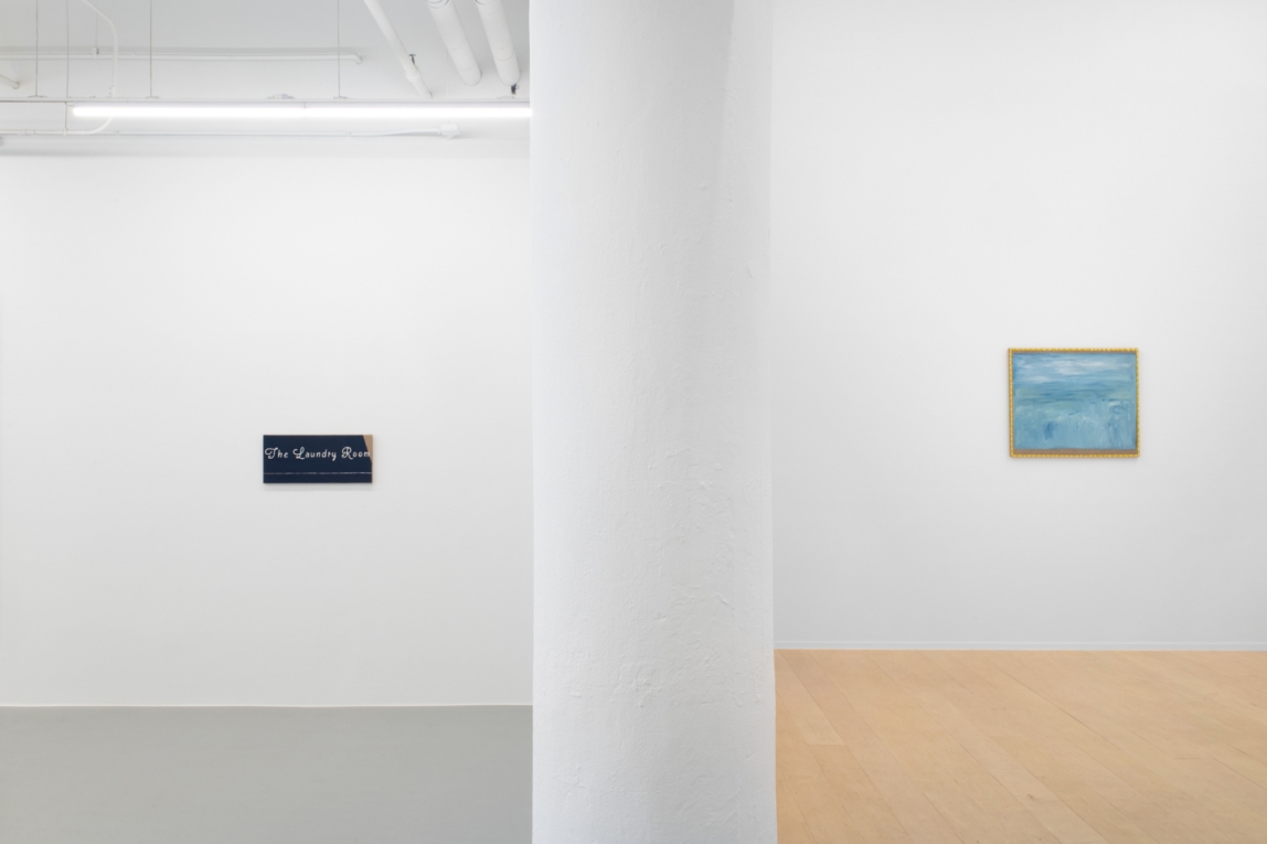 Installation view of two paintings located no either side of a dividing wall