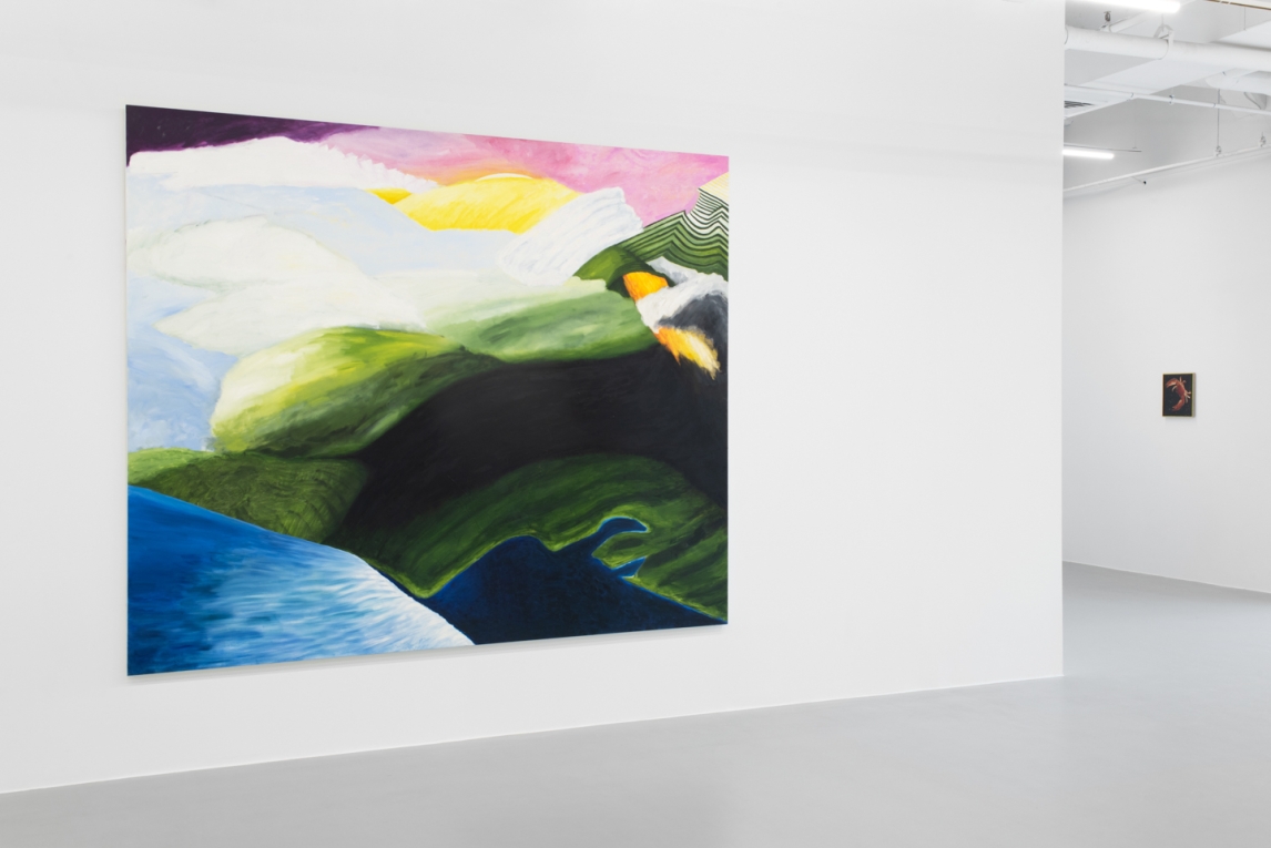 Installation view of large landscape painting in foreground and small one in side background