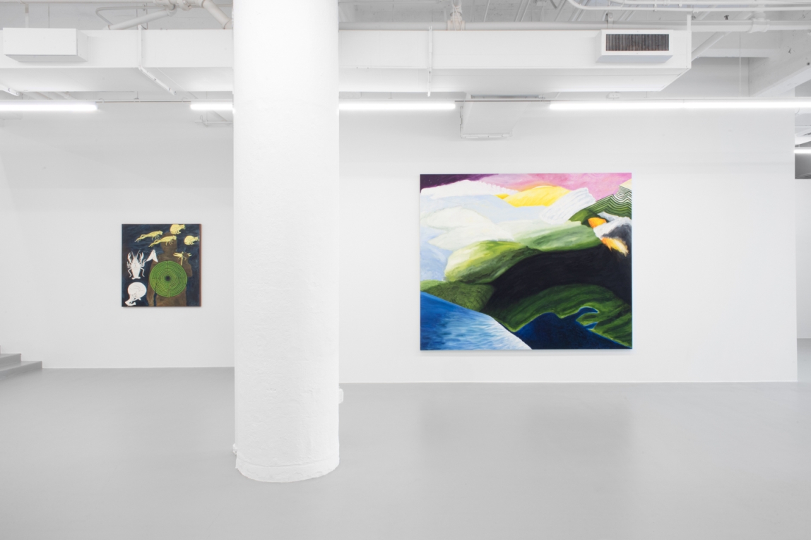 Installation view of gallery with two paintings hanging on wall