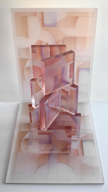 An abstract artwork in varying shades of puce and off white that is against a wall and has a platform that features blocks of translucent puce stacked on one another like a house of cards