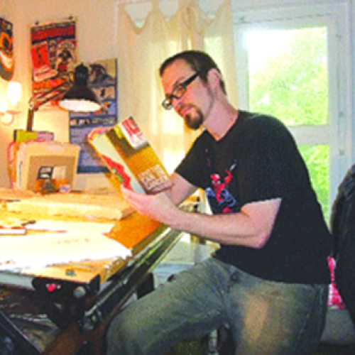 Christian Patchell at his drawing table