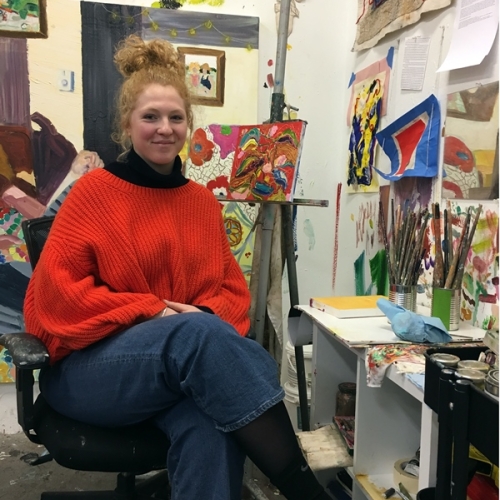 Jessica Dowicz headshot in painting studio