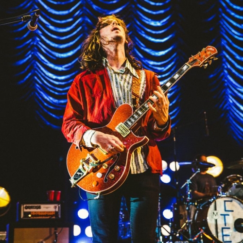 Nick Bockrath playing guitar with Cage the Elephant