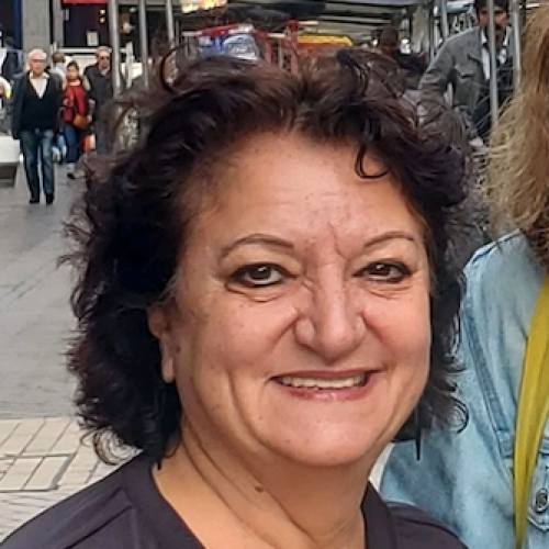 A closeup of Trish Maunder in a black tee shirt and standing on a street