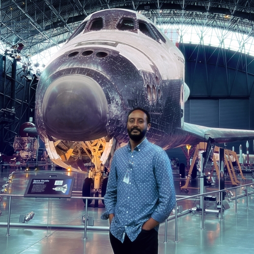 A picture of PhD candidate Abel Tilahun at the Smithsonian Air & Space Museum.