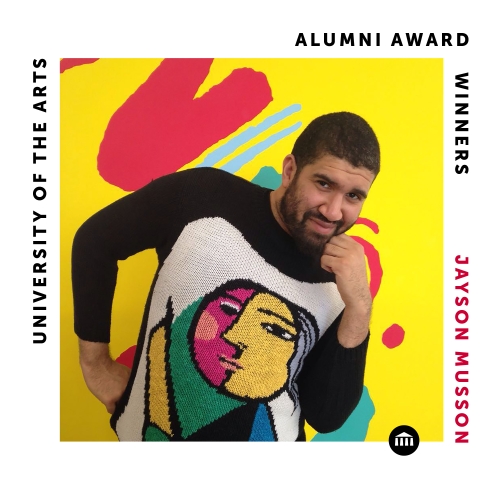 a square labelled image commemorate alumni award winner jayson musson. musson is pictured in an abstract cubist type knit sweater against a yellow background, with one hand on his hips and one raised up to his chin. 