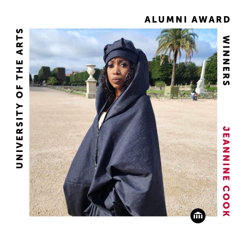a square labelled image commemorate alumni award winner jeannine cook. cook is wearing a dark blue shawl-like cape and is pictured in an ornate garden with large dirt paths extending to small monuments. 