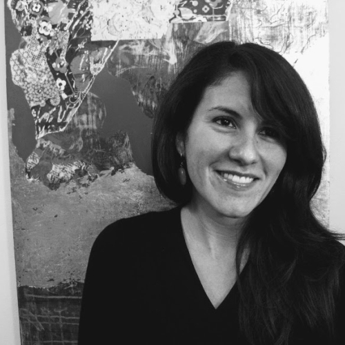 Black and white headshot of Blanca Gonzalez standing in front of a painting by Michele Kishita