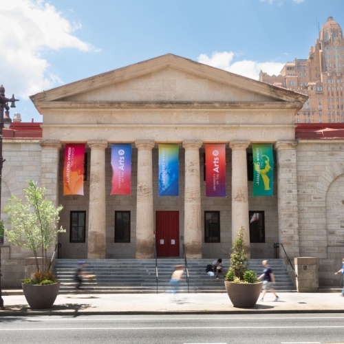 Photo of exterior of the front Hamilton Hall colorful banners