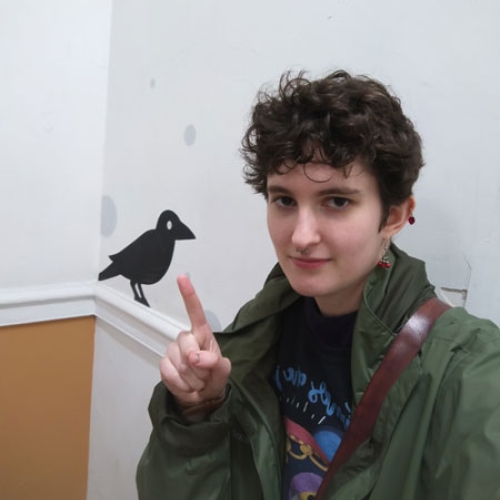 Jack Thornley pointing to a bird.