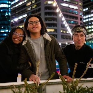 Students pose for a picture while ice skating at Dilworth Park