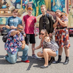Students pose for a picture during the Dive into Philly mural arts tour