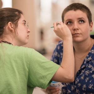 A student gets face paint during UArts Boardwalk–a carnival style evening