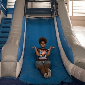 A student enjoys the bounce house during UArts Boardwalk–a carnival style evening event