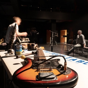 Students set up instruments and gear for the Out of the Box performance.