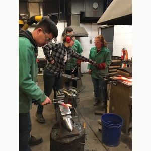 Students and faculty hammer fired metal