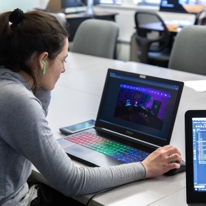 A student uses a computer to create an animation project in the Game Art program.