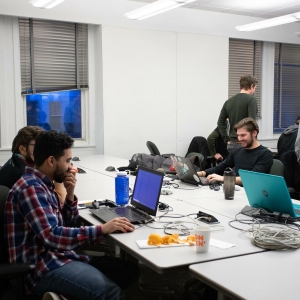 Students work on computers together during the Global Game Jam