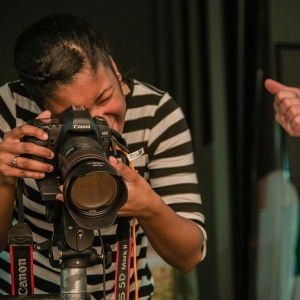 A student takes a photo with their DLSR in the Photography Studio