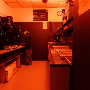 A student works on their film in the Darkroom