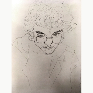 Jack Geissler '23, a quick portrait of a person with curly hair and glasses