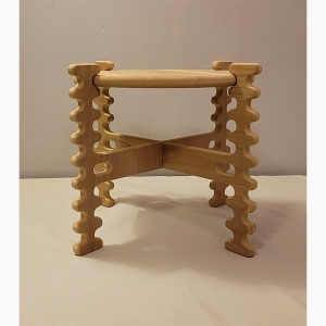 A wooden plant stand with squiggly legs made by Gavin McCoy ’21 (Craft & Material Studies)