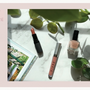 A graphic design brand piece for Vivre featuring their name on lipstick and nail polish. A photo is included of the products on a white marble table with green plants