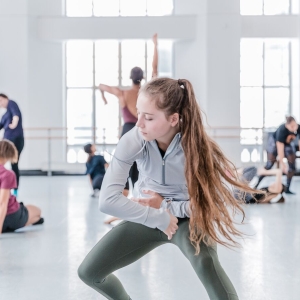 Dancers practice their choreography in the studio