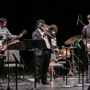 A small jazz ensemble performs on stage